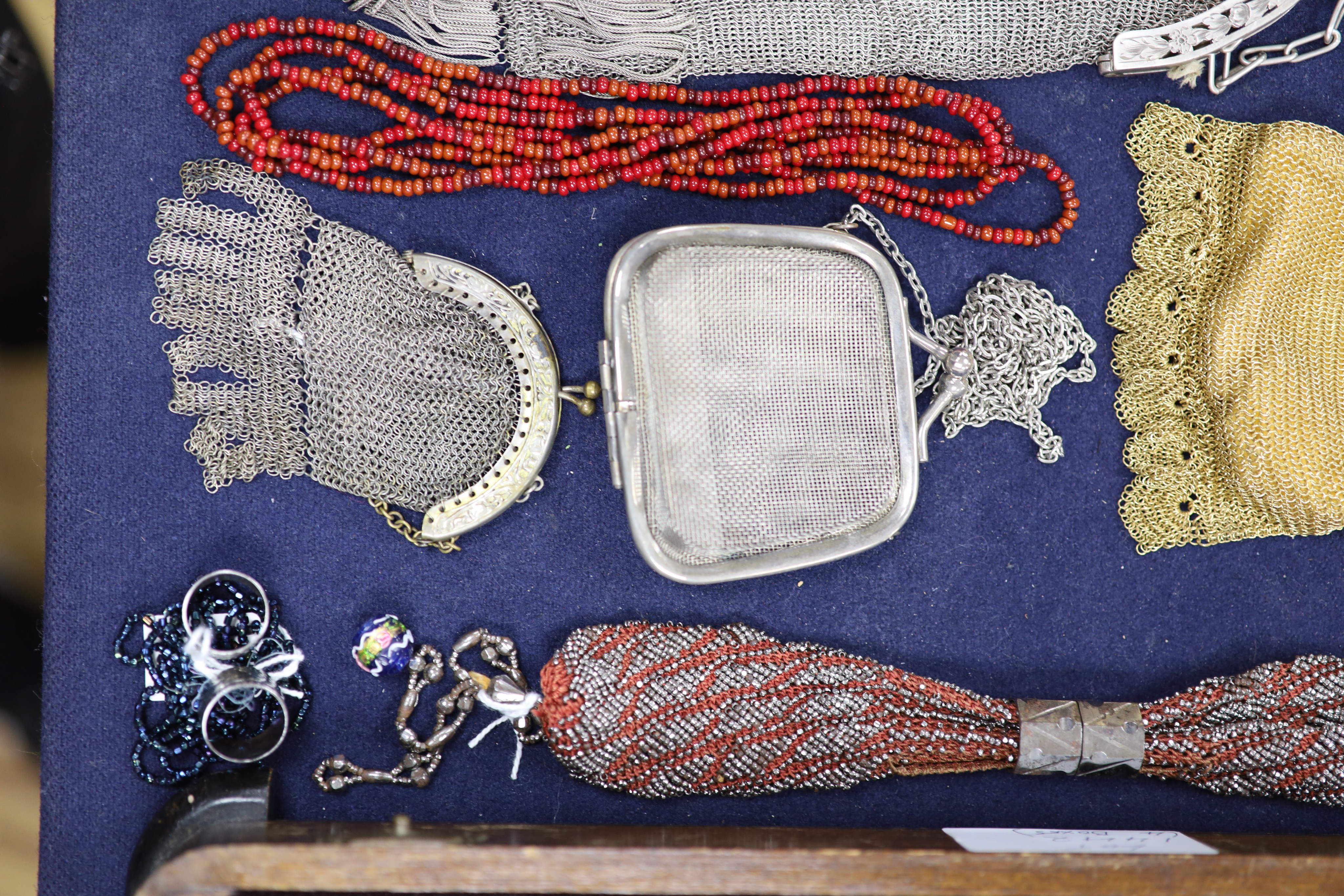 A collection of approximately fifty Victorian and later beadwork, white metal and fabric purses etc.